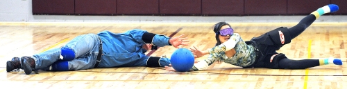 teve Lambert, left of Lewiston and Lauren Freitas of Auburn, work together to stop a shot by the opposing team during a friendly game of Goalball at the Hasty Memorial Armory in Auburn Saturday morning.  The event was put on by the National Federation of the Blind of Maine, with instruction from Mark Sinclair from the New England Blind Athletes Association.  The sport was designed for blind athletes, but anyone  is incouraged to try it as everyone playing must wear eyeshades.  For more information on upcoming events, including another day of goalball coming up May 25th, contact Patricia Estes at 783-0325.