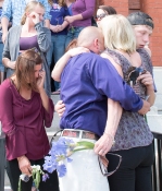 Ricky Gaboury and Tena Trask embrace with other family and friends outside Feranklin County Superior Court following Monday's plea agreement from Tommy Clark, who killed their daughter in a hit and run accident earlier this year.